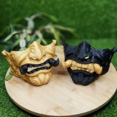 Elevate your style with this wearable 3D printed Japanese Oni mask, made from durable black and gold ABS for a bold,