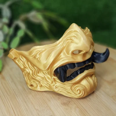 Elevate your style with this wearable 3D printed Japanese Oni mask, made from durable black and gold ABS for a bold,