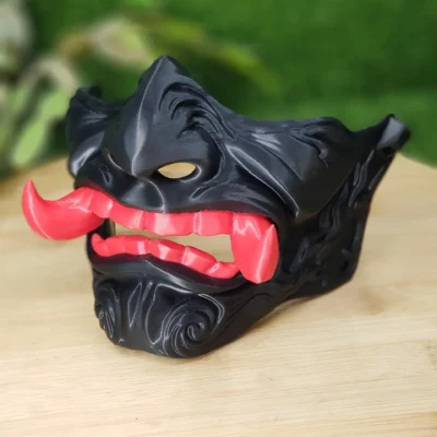 Elevate your style with this wearable 3D-printed Japanese Oni mask, made from durable black, green or red ABS for a bold,