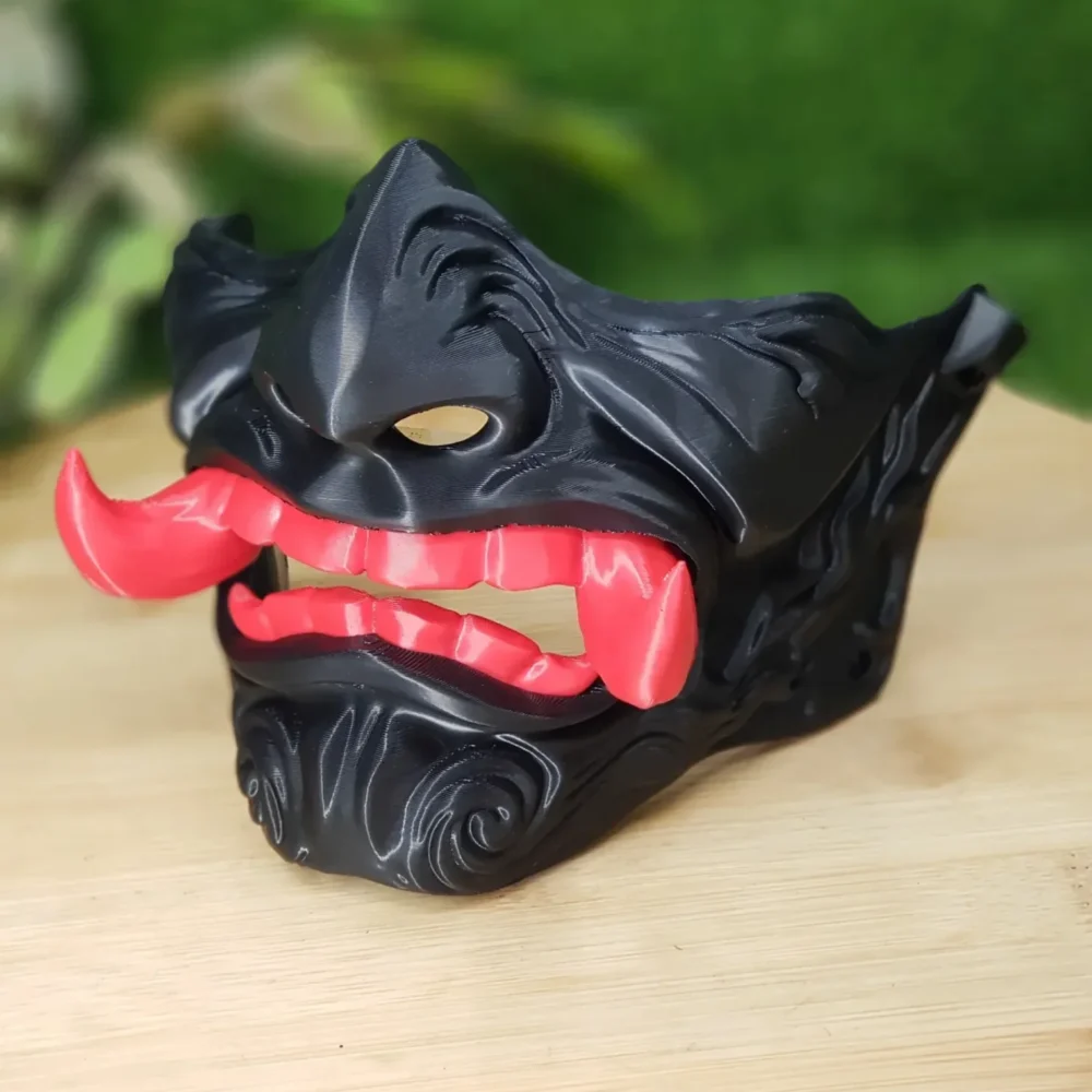 Elevate your style with this wearable 3D-printed Japanese Oni mask, made from durable black, green or red ABS for a bold,