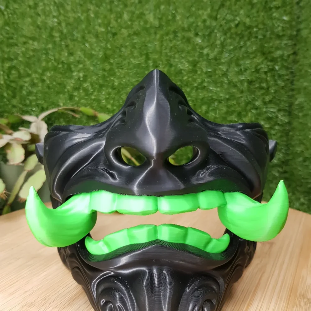Elevate your style with this wearable 3D-printed Japanese Oni mask, made from durable black, green or red ABS for a bold,