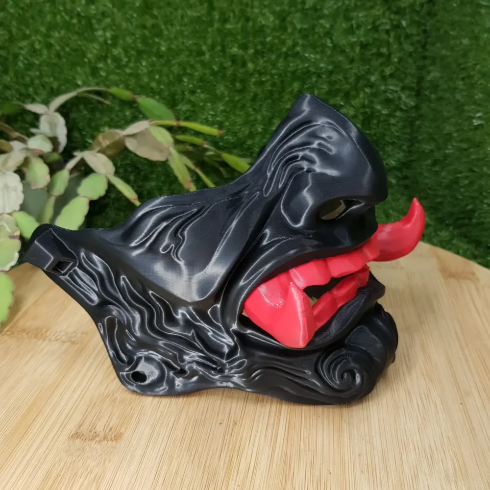 Elevate your style with this wearable 3D-printed Japanese Oni mask, made from durable black, green or red ABS for a bold,