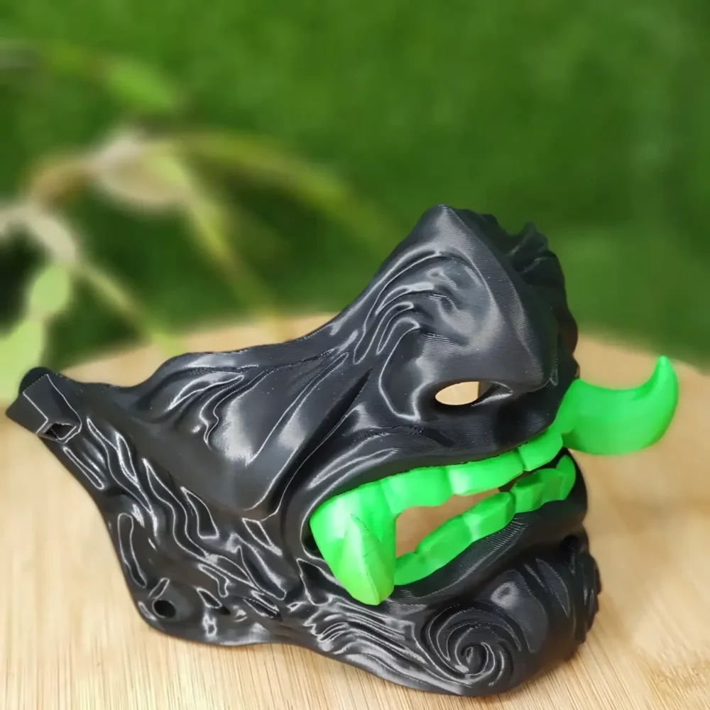 Elevate your style with this wearable 3D-printed Japanese Oni mask, made from durable black, green or red ABS for a bold,