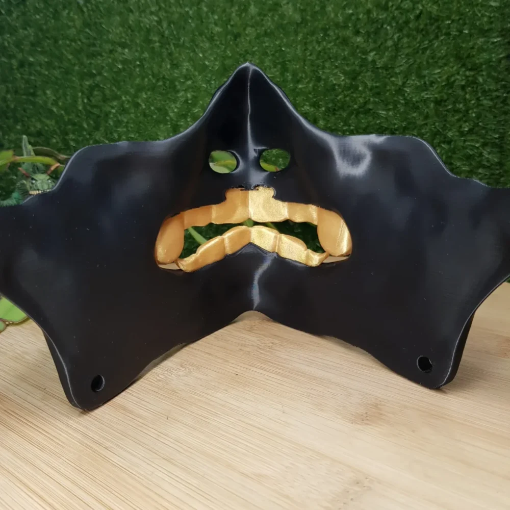 Elevate your style with this wearable 3D printed Japanese Oni mask, made from durable black and gold ABS for a bold,