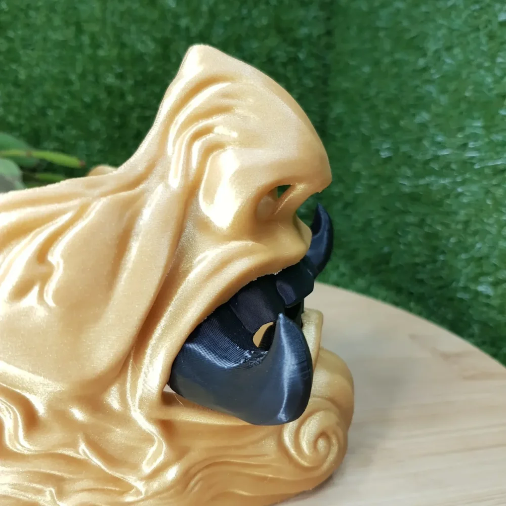 Elevate your style with this wearable 3D printed Japanese Oni mask, made from durable black and gold ABS for a bold,
