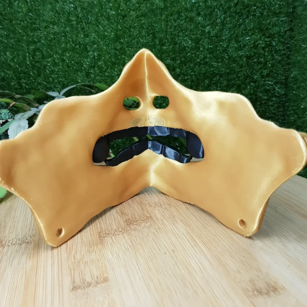 Elevate your style with this wearable 3D printed Japanese Oni mask, made from durable black and gold ABS for a bold,