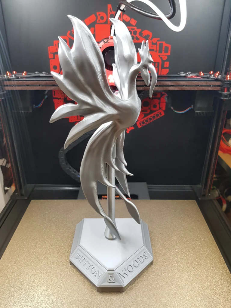 Finished phoenix sculpture on its base inside the Voron 2.4